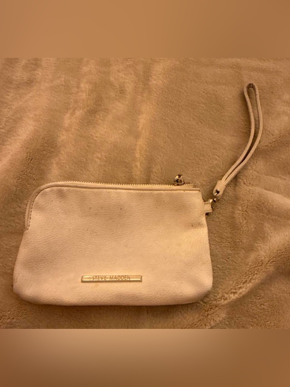 Steve Madden cream wristlet clutch with gold logo